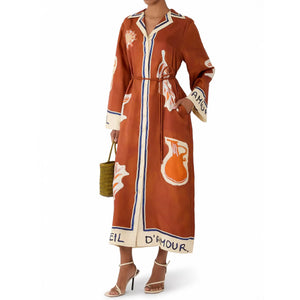 Terracotta art print dress styled with a belt