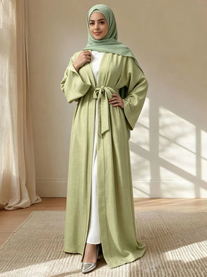 Green open abaya styled with a coordinating hijab