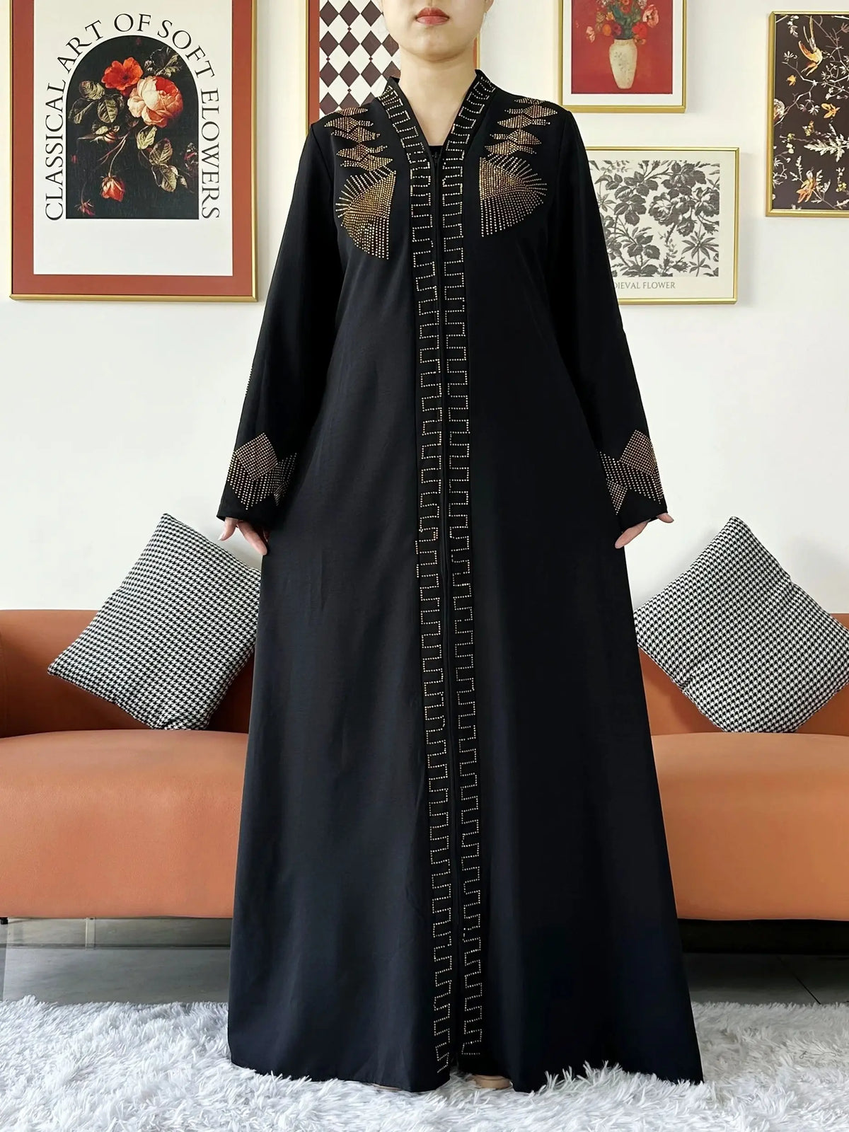 HIA Embellished Zip-Front Abaya — Black abaya with gold-toned detail, front view