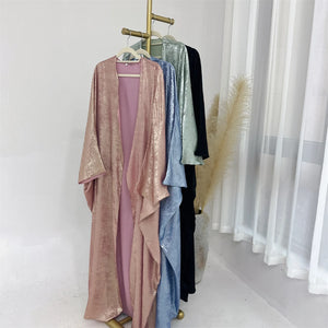 HIA Textured Satin-Look Open Abaya — Four colour options hanging on a clothing rail