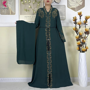 Forest green Ornate abaya with belt and matching fabric shown