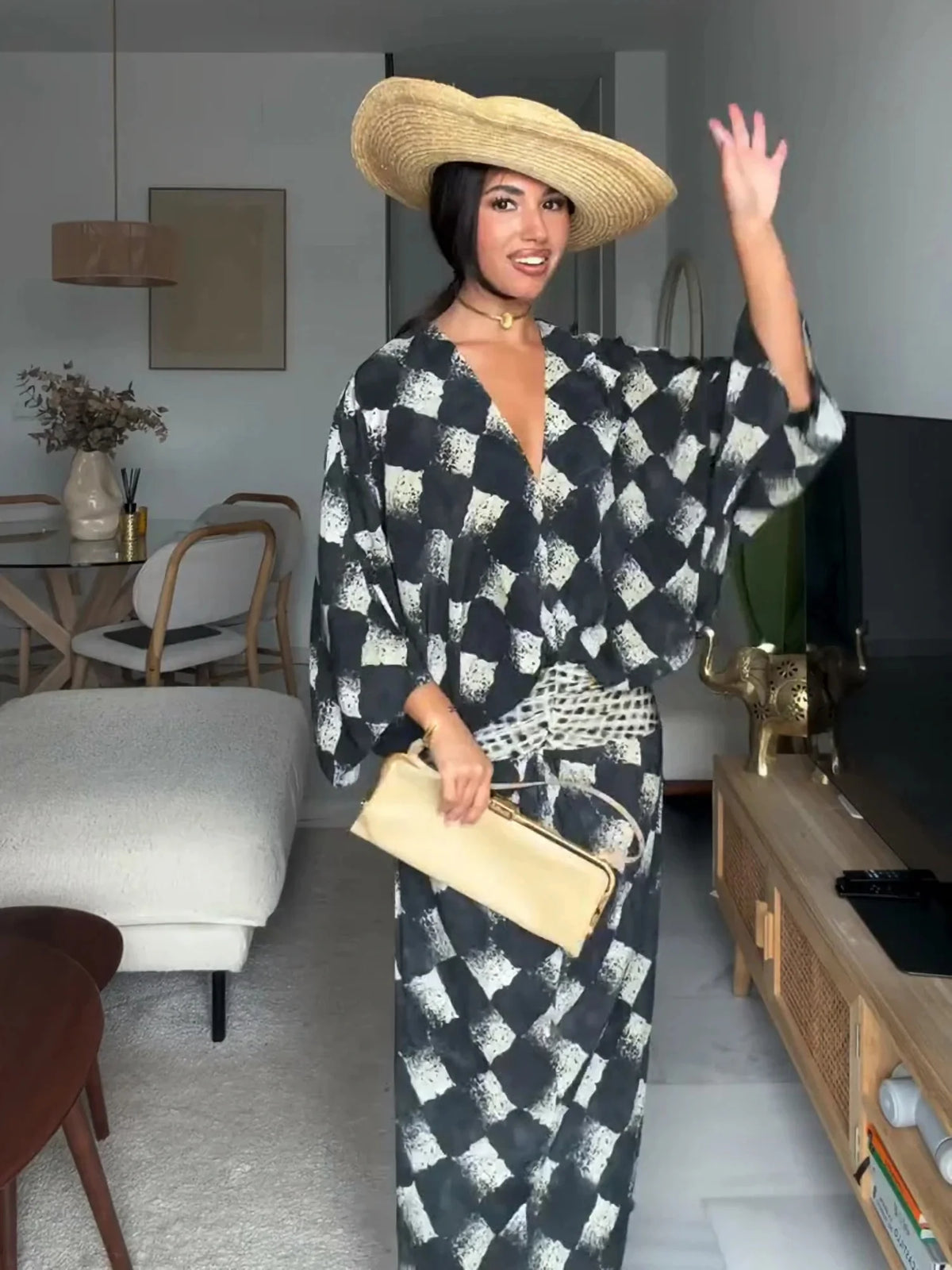 HIA diamond print twist-front dress — styled front view with hat