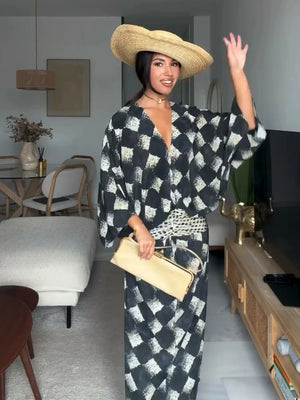 HIA diamond print twist-front dress — styled front view with hat
