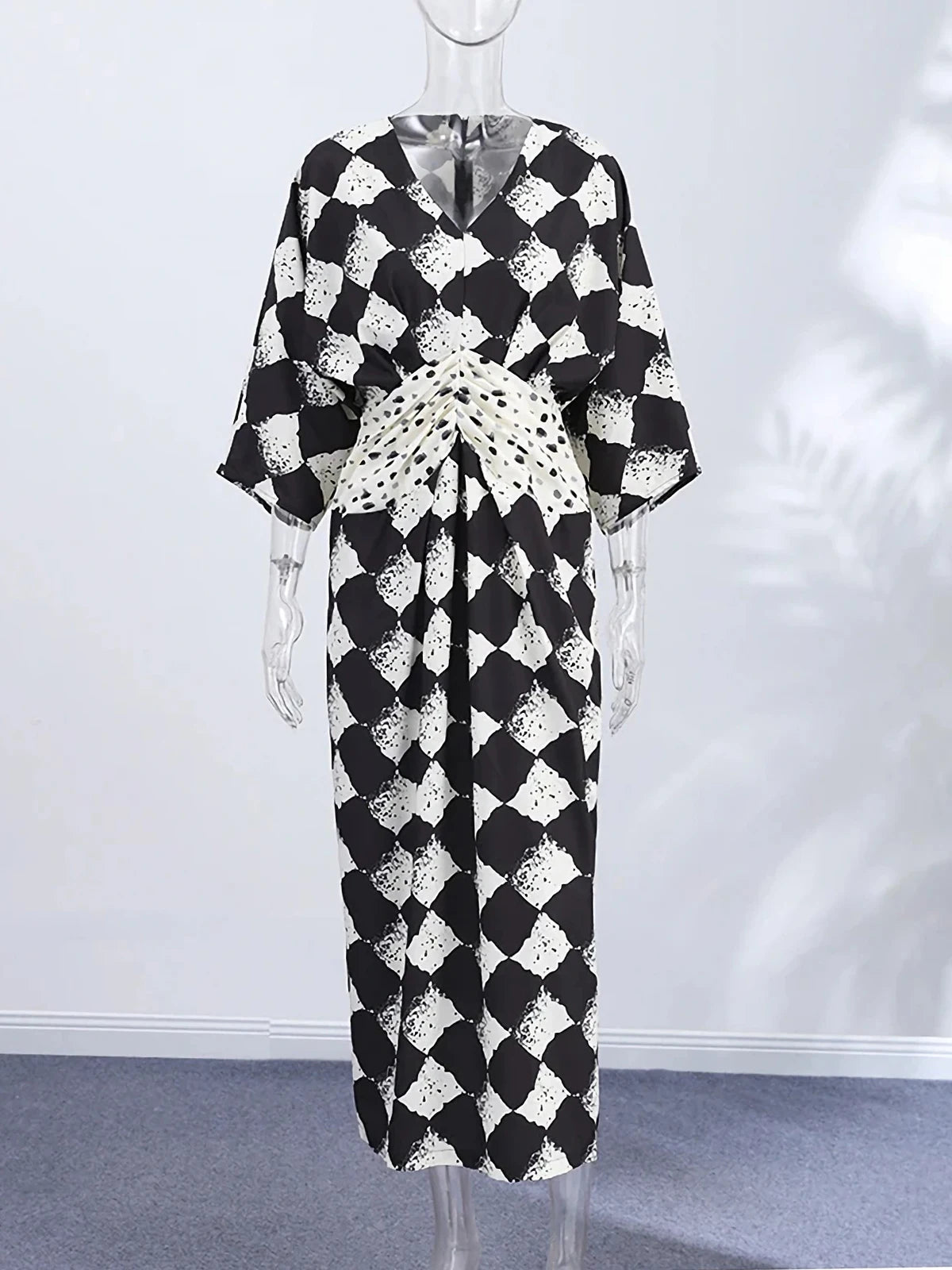 HIA diamond print twist-front dress — mannequin front view