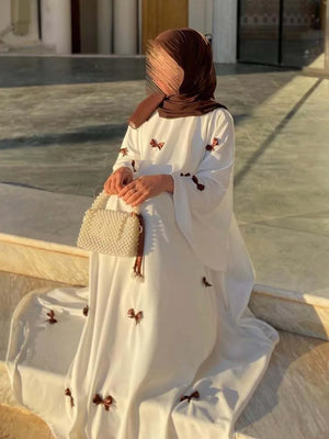 HIA Bow-Detail Flared-Sleeve Abaya — product styling and bow detail 4