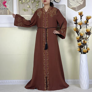 Brown Ornate abaya showing the wide sleeves
