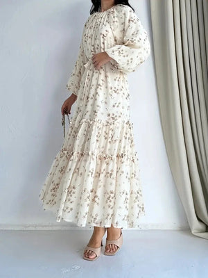 Side view of the cream floral tiered long dress