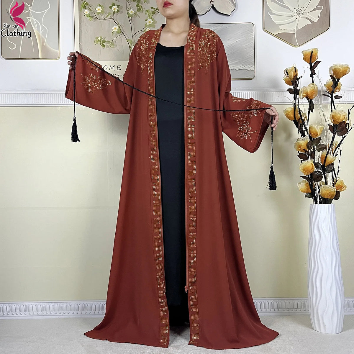 Rust Ornate abaya shown open over an inner layer