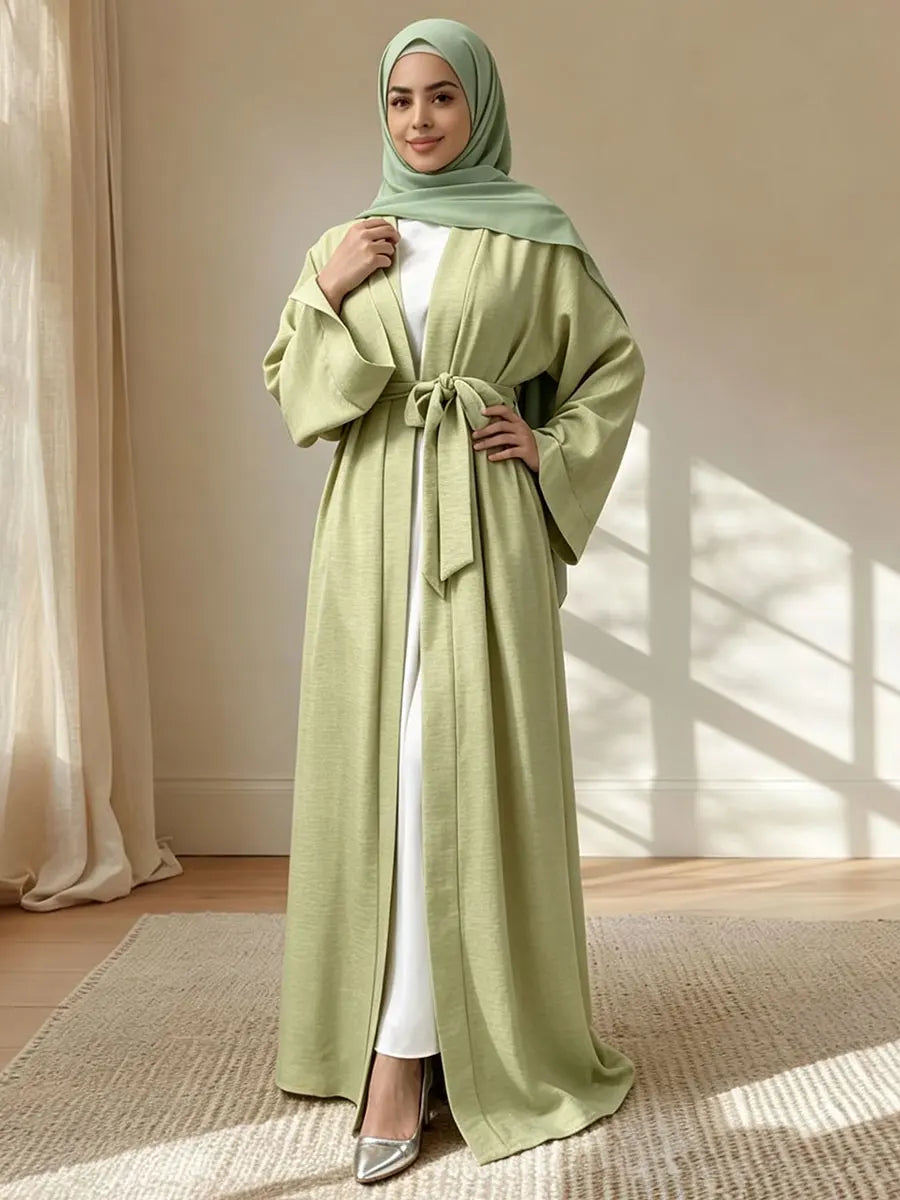 Green open abaya styled with a coordinating hijab