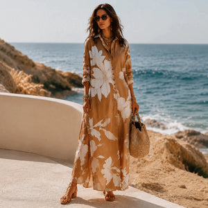 Brown botanical print shirt dress styled by the sea