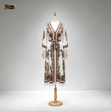 HIA ivory and brown floral belted dress — mannequin back view