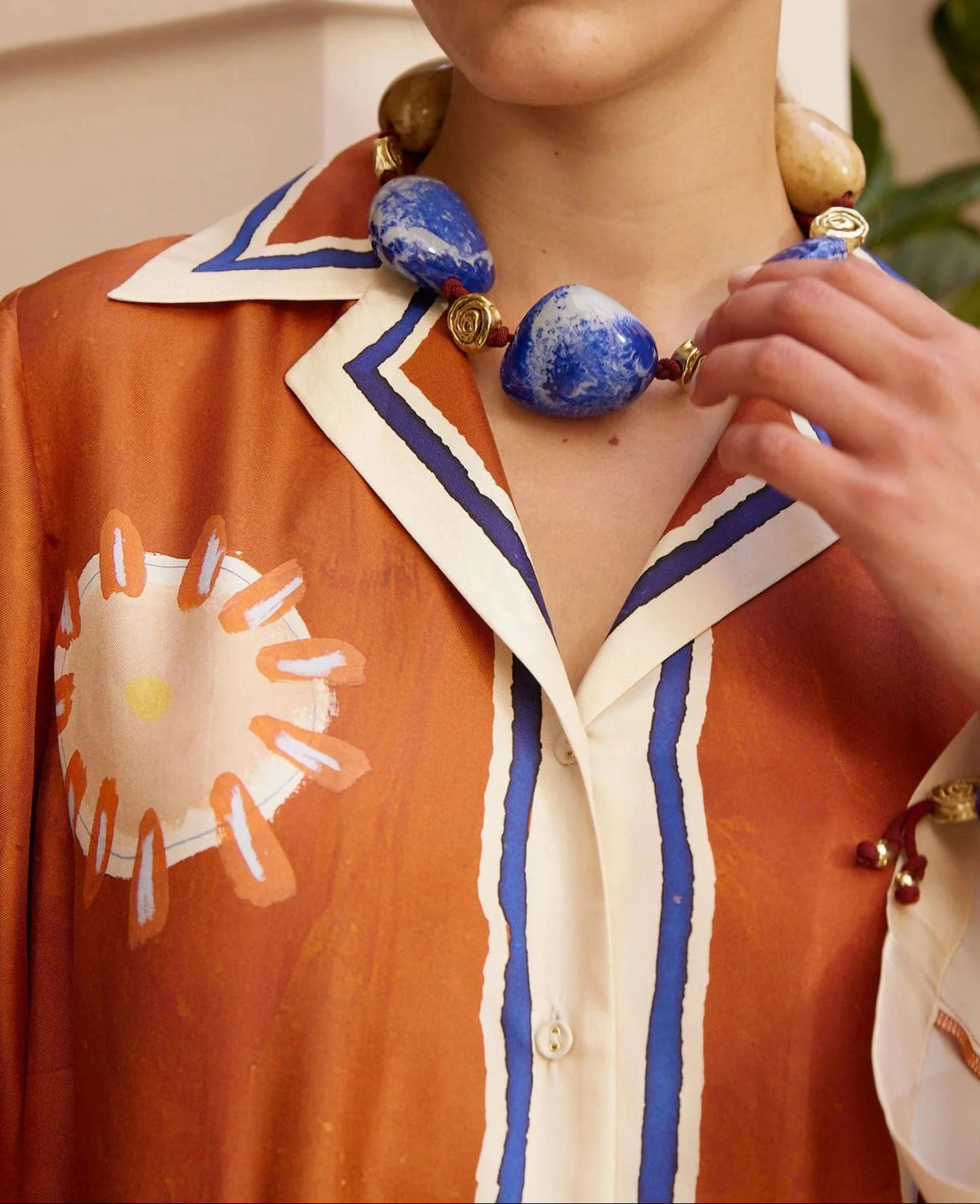Contrast collar and button detail of art print dress