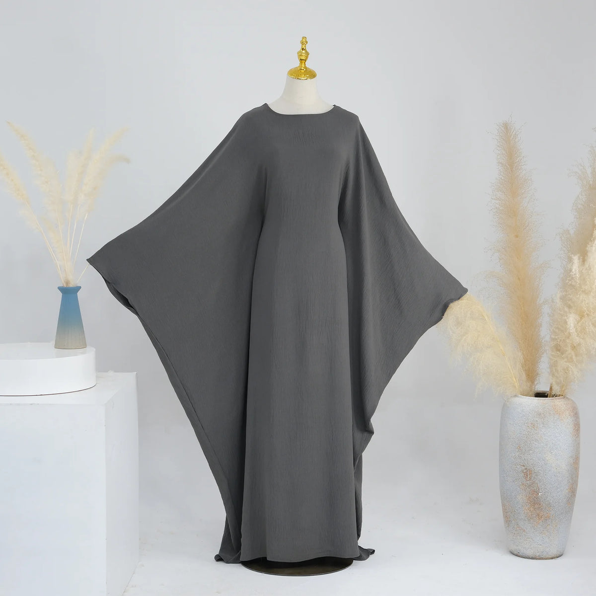 Dark gray batwing abaya displayed on a mannequin