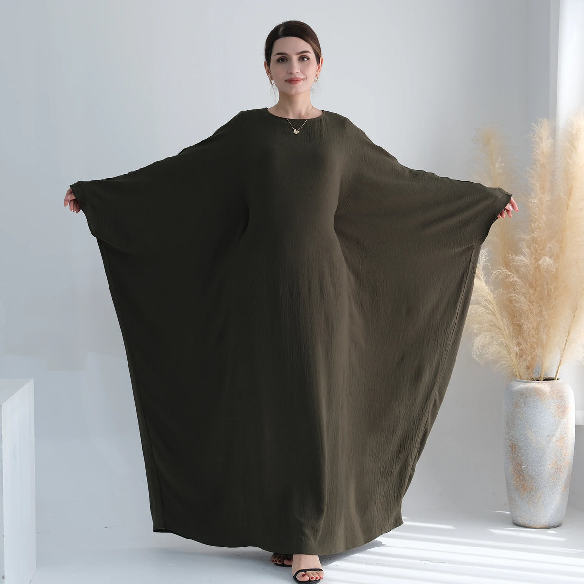 Army green batwing abaya showing the full sleeve silhouette