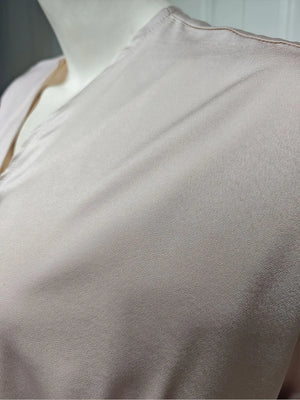 Close-up of the taupe abaya fabric and seam