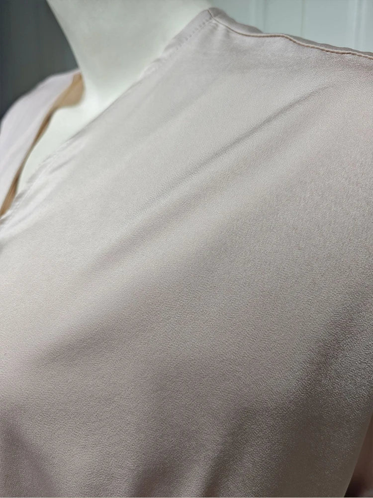 Close-up of the taupe abaya fabric and seam