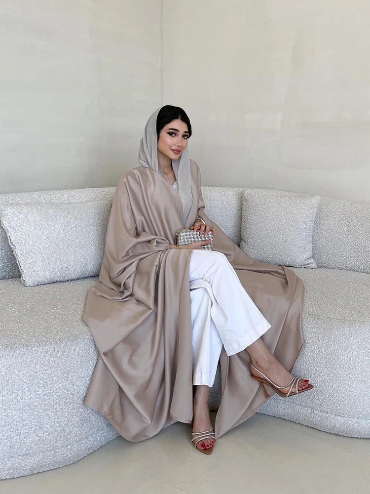 Alternate seated view showing the drape of the taupe open abaya
