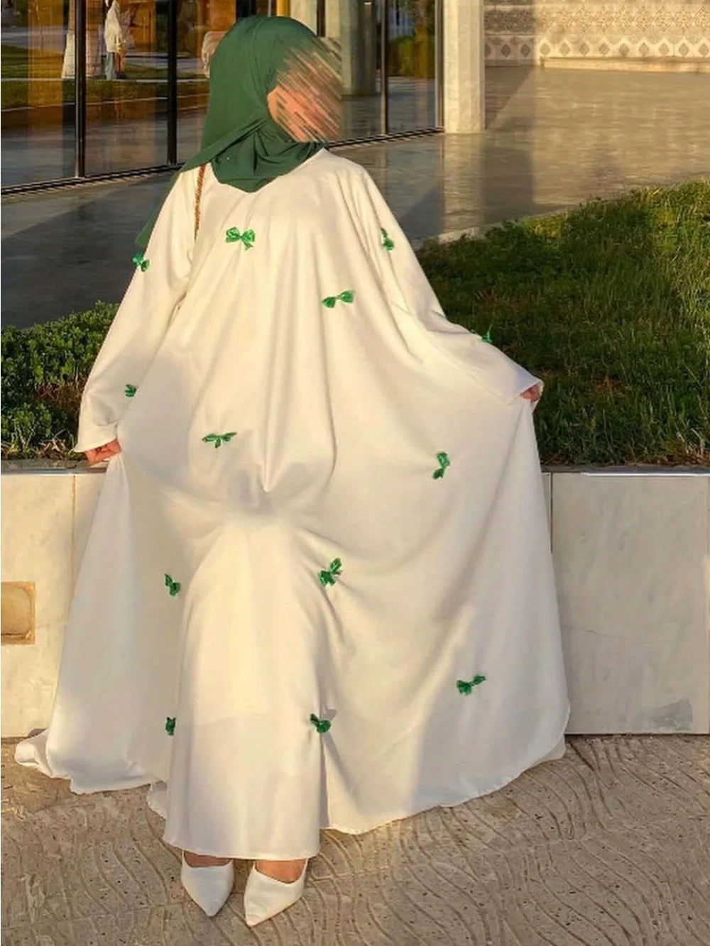 HIA Bow-Detail Flared-Sleeve Abaya — product styling and bow detail 7