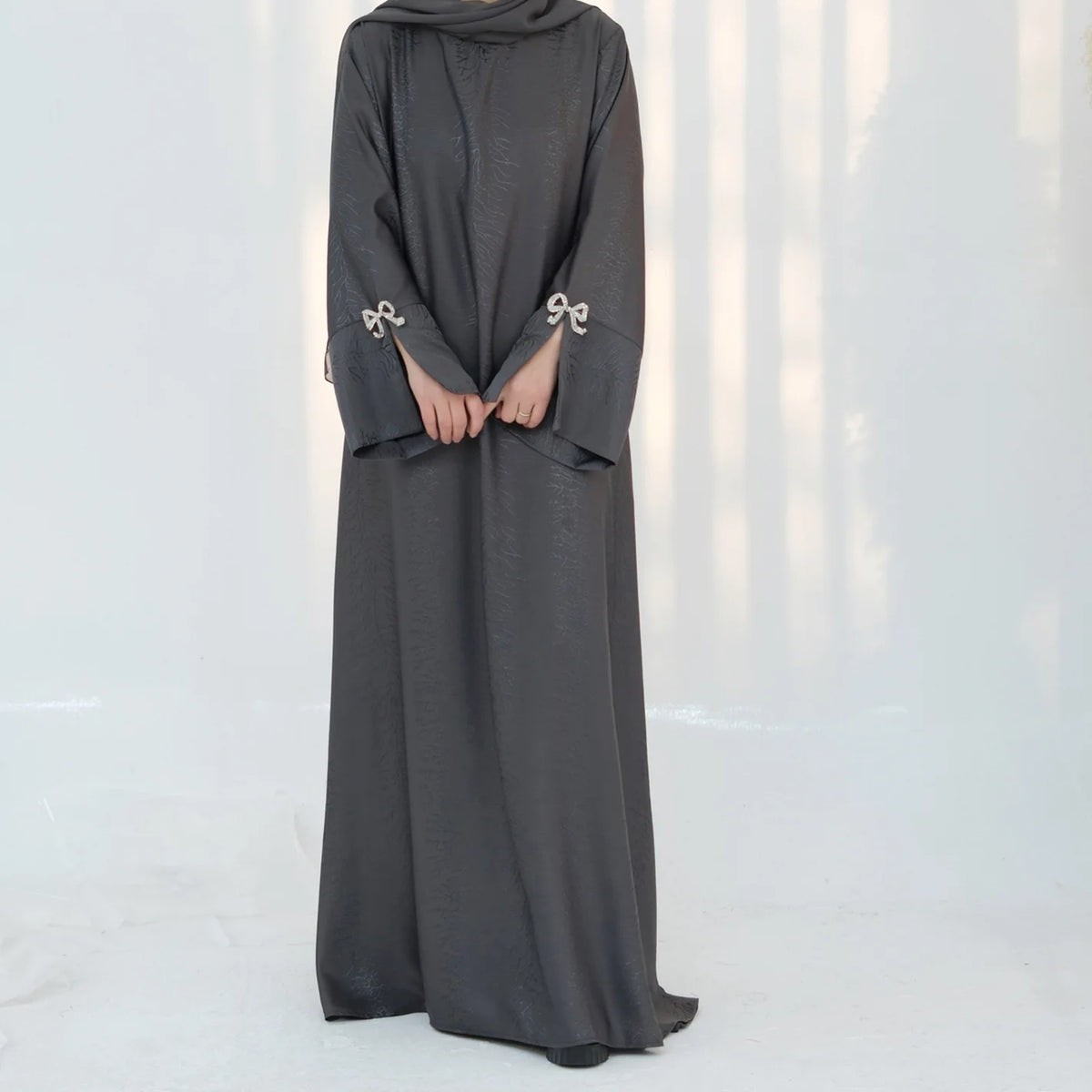 HIA Bow-Cuff Satin Abaya — Coffee cuff detail