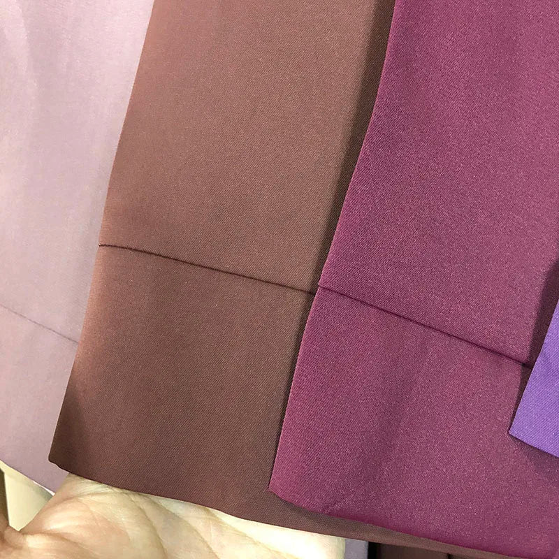 Close-up of Nida fabric and sleeve hems in neutral and purple colours