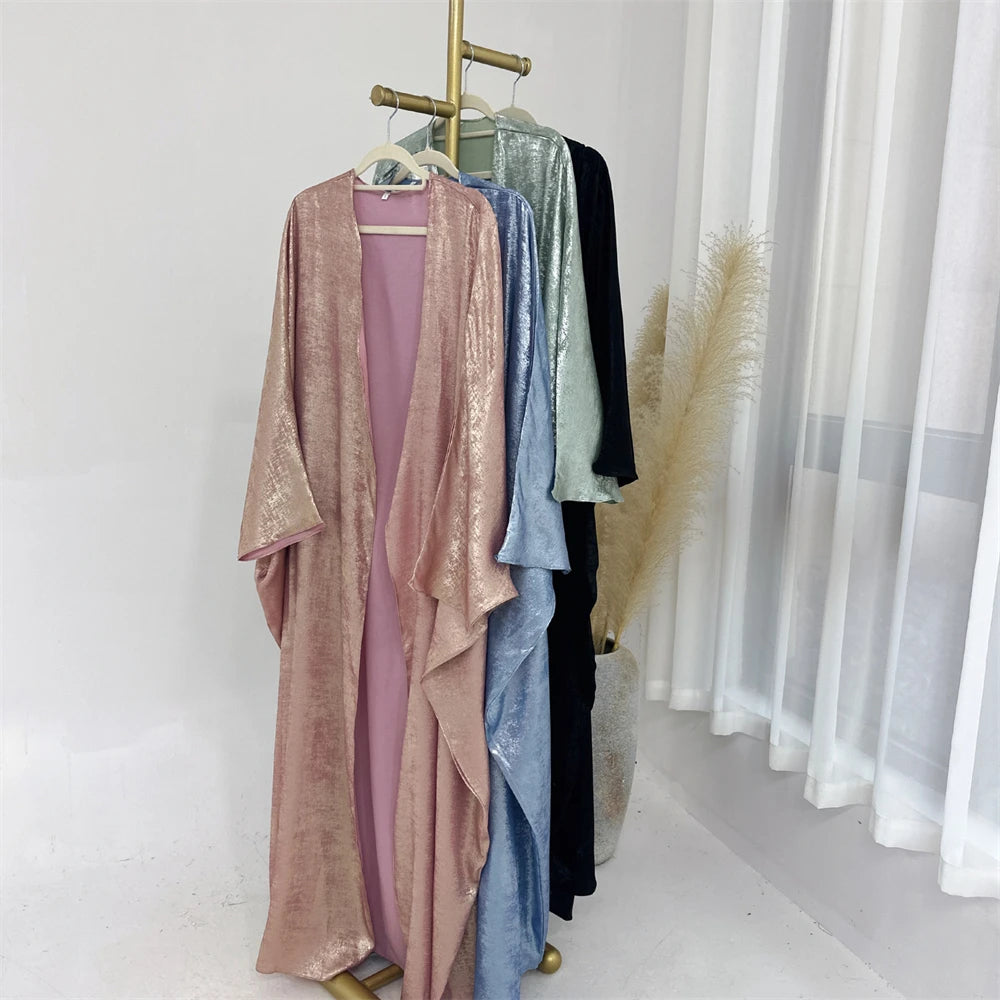 HIA Textured Satin-Look Open Abaya — Four colour options hanging on a clothing rail