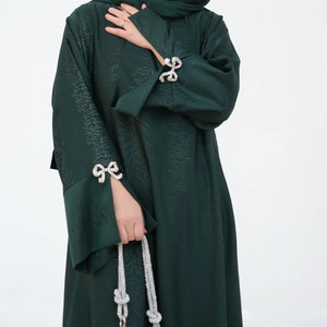 HIA Bow-Cuff Satin Abaya — Deep Green cuff detail