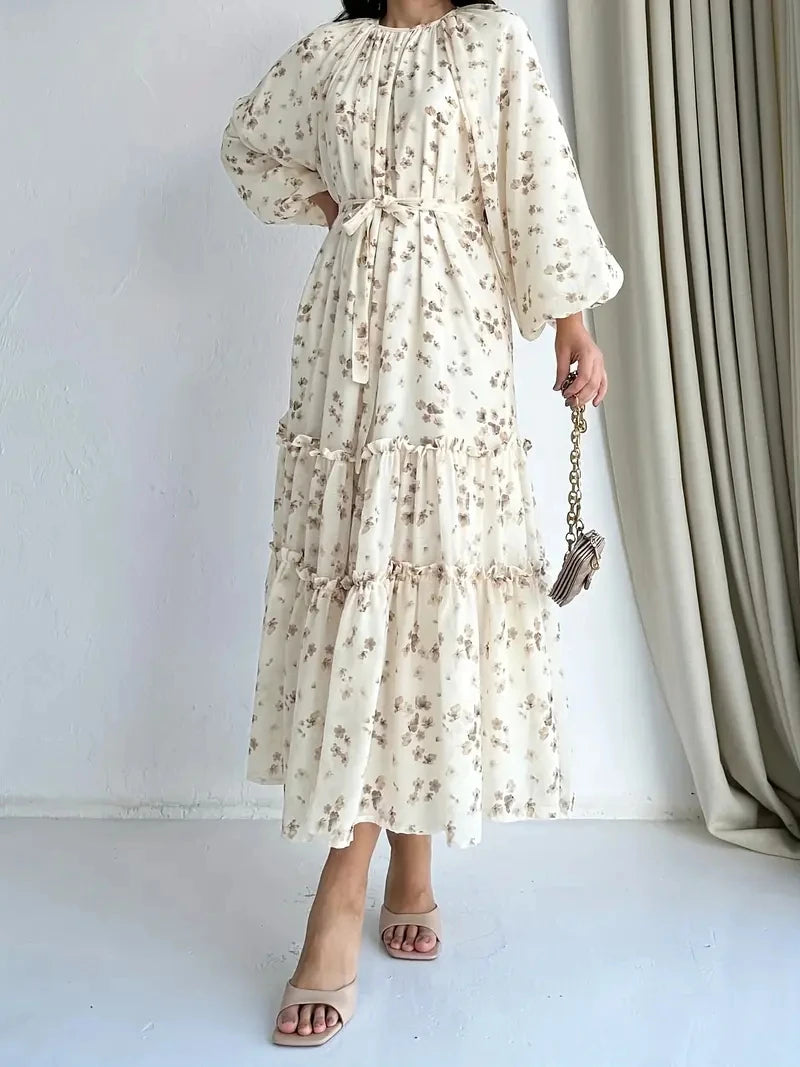 Cream floral long dress showing the coordinating waist tie