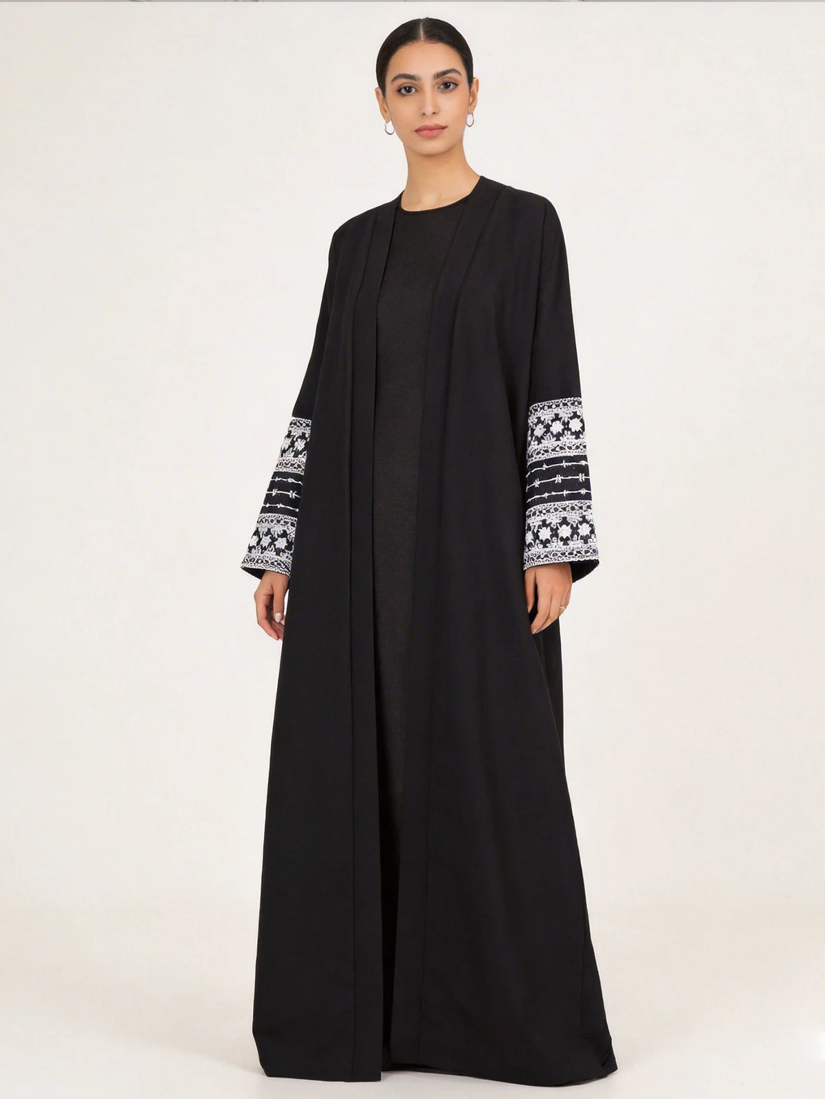 HIA black open abaya with white patterned cuffs – front view