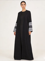 HIA black open abaya with white patterned cuffs – front view
