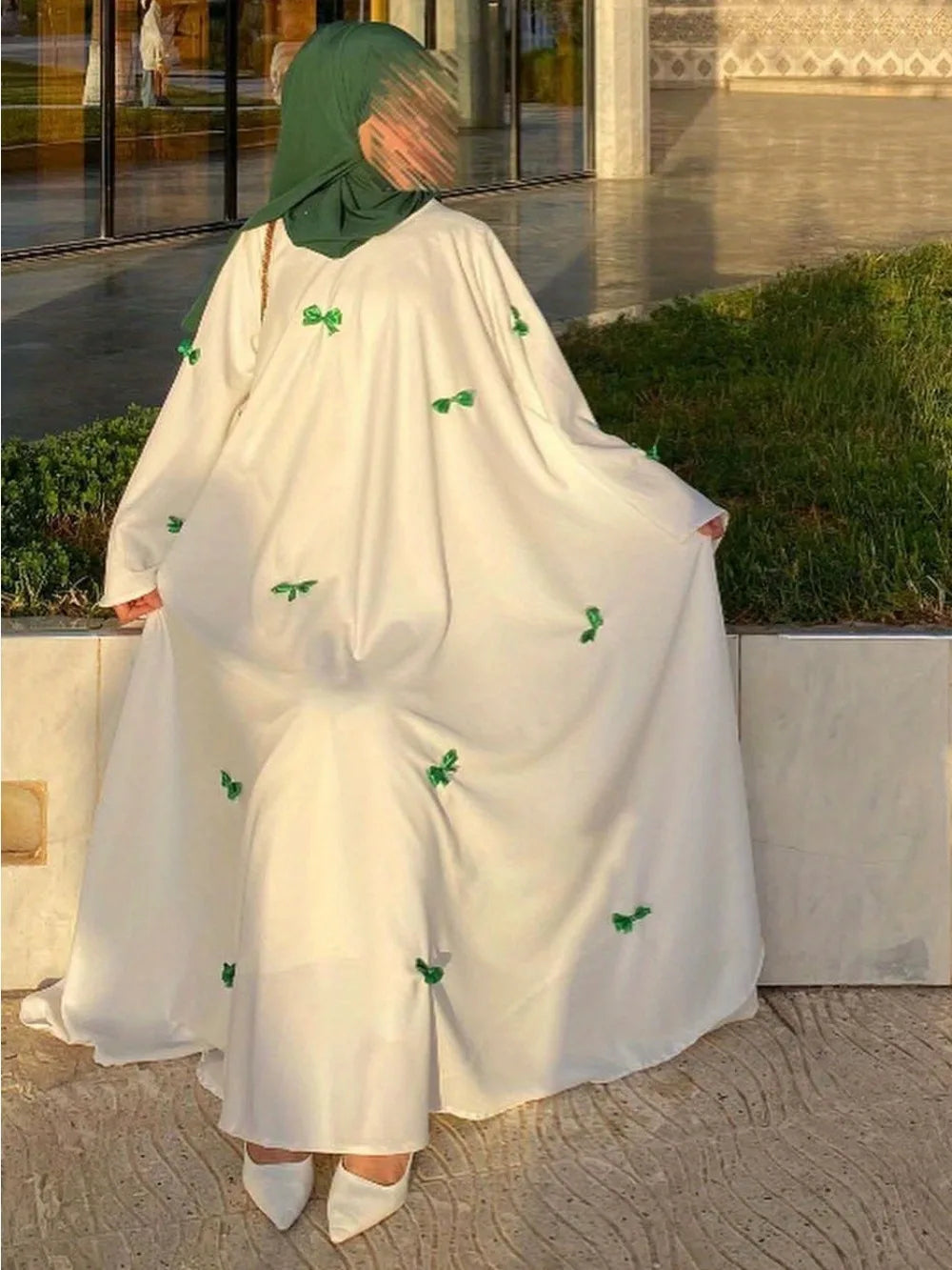 HIA Bow-Detail Flared-Sleeve Abaya — product styling and bow detail 6