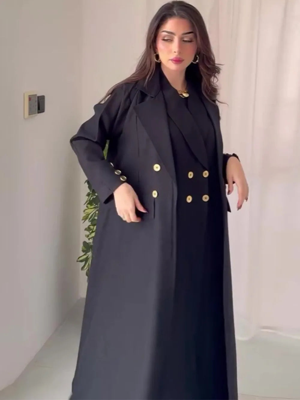Collar and button detail on HIA black abaya